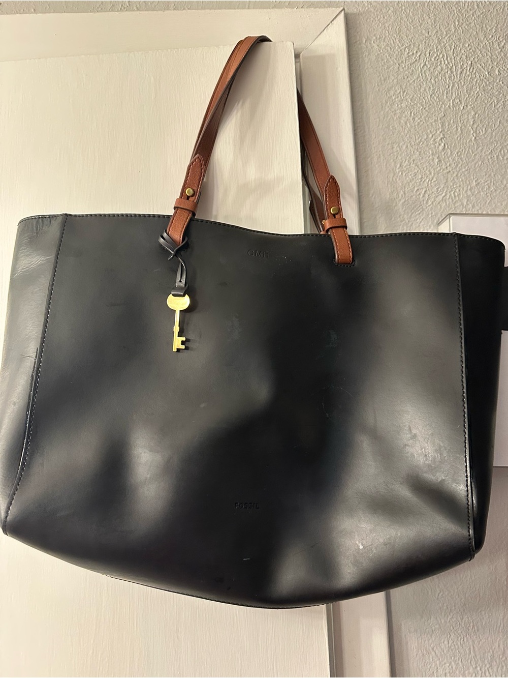 Fossil Black Leather Tote with Brown Handles and Gold Key Charm